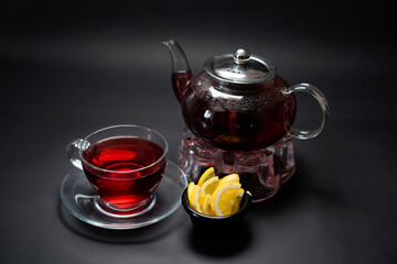 Red Tea with Teapot isolated on black background