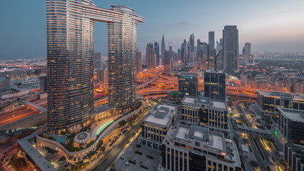 Obraz premium Futuristic Dubai Downtown and finansial district skyline aerial night to day timelapse.