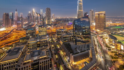 Fototapeta na wymiar Futuristic Dubai Downtown and finansial district skyline aerial day to night timelapse.