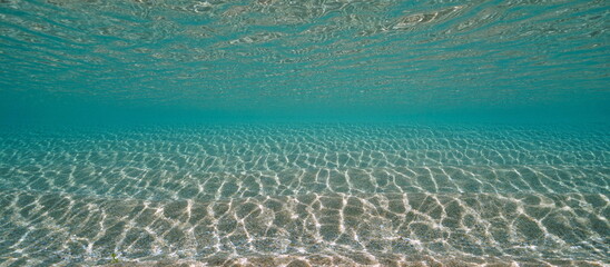 Ripples of sand and water surface underwater in the Atlantic ocean in shallow water, natural scene, Spain © dam