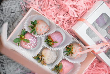 strawberries in chocolate in a pink gift box for a girl