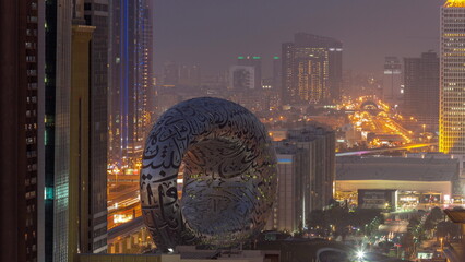 Museum of the Future exhibition space aerial day to night timelapse with iconic torus shape