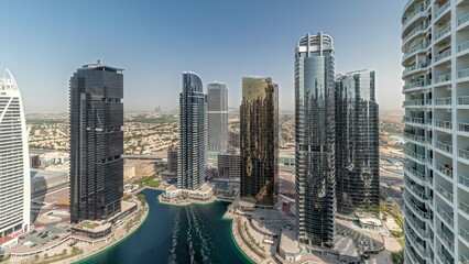 Panorama showing tall residential buildings at JLT aerial timelapse, part of the Dubai multi commodities centre mixed-use district.