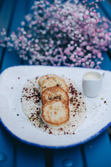 a plate of chesse pancakes Ukrainian syrniki