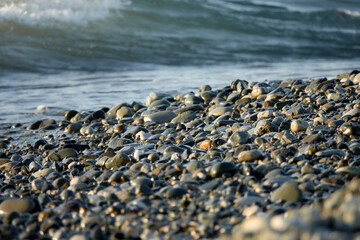 Sea waves. Sun glare in the waves.