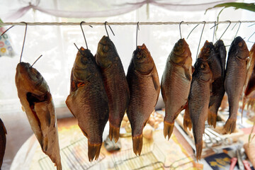 River fish dried on ropes.
