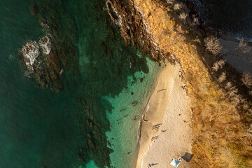Aerial view of a tropical beach with partial reef