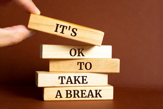 Wooden blocks with words 'it's ok to take a break'.