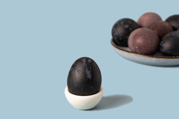Blue and purple easter eggs on a blue background