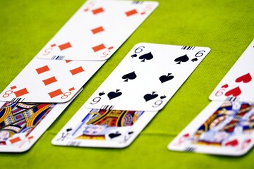 Bridge cards on a green card table