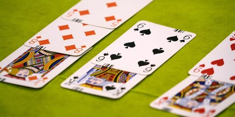 Bridge cards on a green card table