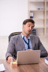 Young male employee working in the office
