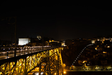 Enchanting Nocturnal Perspective: The Majestic Dom Luís Bridge in Porto, Portugal