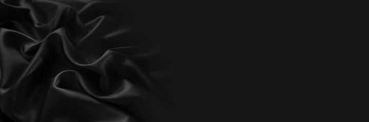 Black silk satin. Dark elegant background with space for design. Creases in fabric. Shiny, soft, smooth. Wide banner. Panoramic. Template.