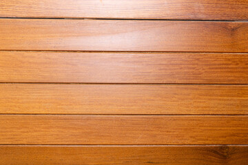 Brown slatted wood texture with grain between the slats
