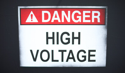 High voltage danger sign on wall for caution and security symbolizing warning dangerous zone