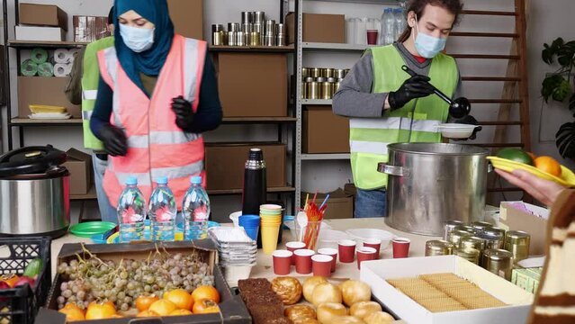 Volunteers Distribute Hot Meals to the Needy 