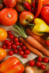 Different fresh ripe vegetables on wooden table, flat lay