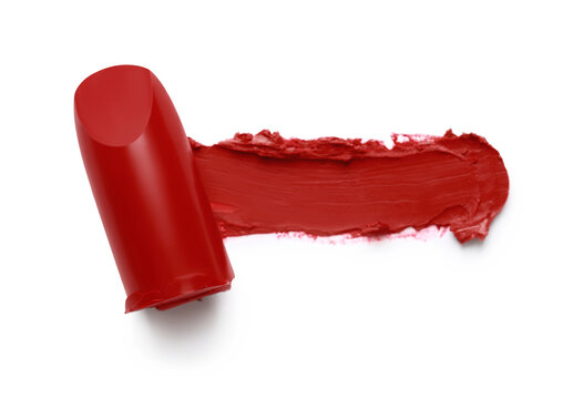 Bright lipstick and smear on white background, top view