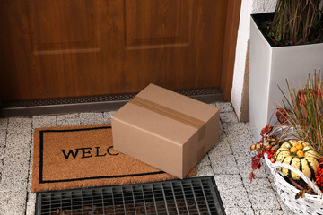 Parcel delivered on mat near front door