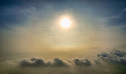 The background of the morning sunrise from the air with the clouds and the rising sun is very impressive to welcome the new day