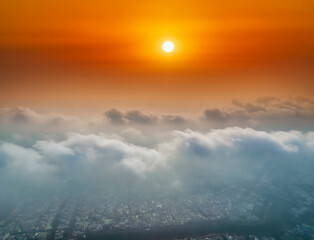 Obraz premium The background of the morning sunrise from the air with the clouds and the rising sun is very impressive to welcome the new day
