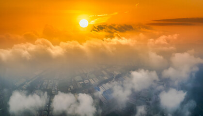 The background of the morning sunrise from the air with the clouds and the rising sun is very impressive to welcome the new day