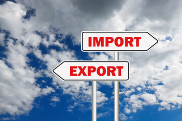 Road sign with Import and Export words on arrows pointing in opposite directions against sky