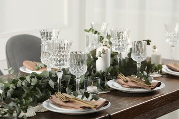 Stylish elegant table setting for festive dinner indoors