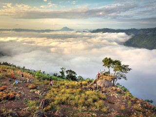 Tourists at Hang Kia-Pa Co. Hang Kia - Pa Co valley is surrounded by four rocky mountains, covered with clouds all year. Hang Kia-Pa Co in Mai Chau district, Son La province, Vietnam