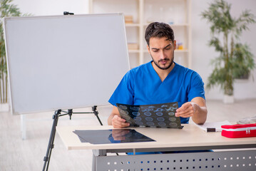 Young male doctor radiologist working in the clinic