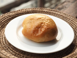 soft bread bun on white dish