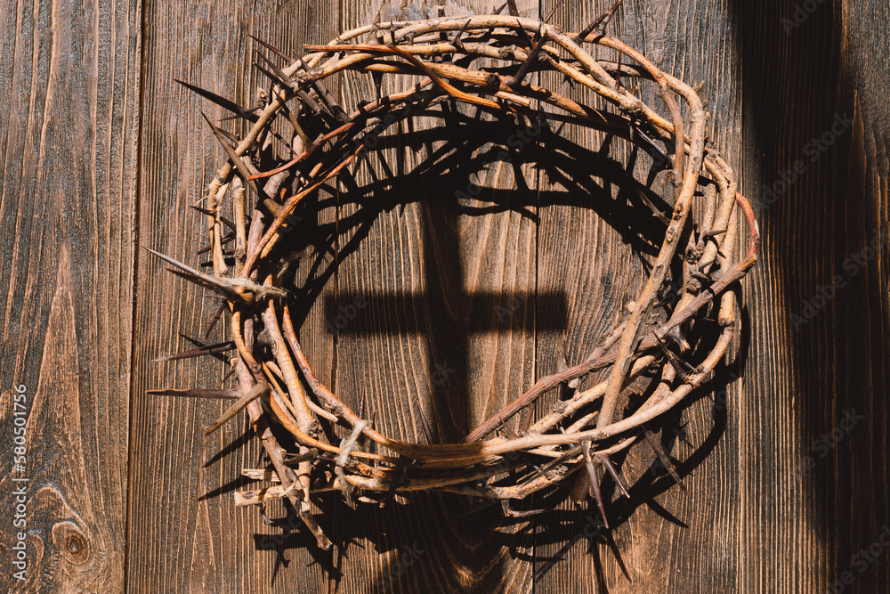 Wall mural jesus crown thorns and nails and cross on a wood background. crucifixion of jesus christ. passion of