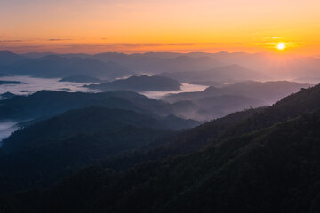 The sunrise over the mountain with sea of fog in the western of Thailand (Tha Song Yang District, Tak province)