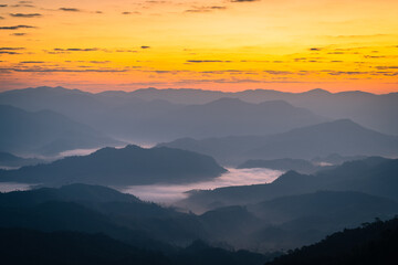 The sunrise over the mountain with sea of fog in the western of Thailand (Tha Song Yang District, Tak province)