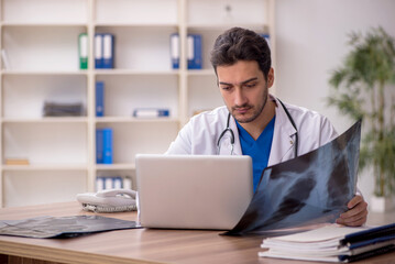 Fototapeta premium Young male doctor radiologist working in the clinic