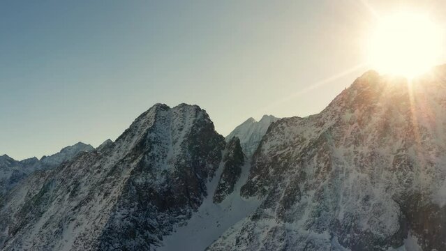 Aerial drone shot of Italian Mountains in Wintertime before Senset.
Cinematic shot over Presena Italian Alps at dusk.