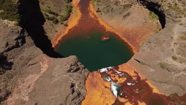 Magnificent top aerial view over waterfall "Salto del Agrio" near Caviahue, Argentina Patagonia. Video shooting done during daytime and nice sunshine day.