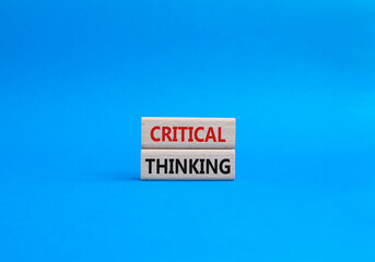 Critical thinking symbol. Wooden blocks with words Critical thinking. Beautiful blue background. Business and Critical thinking concept. Copy space.