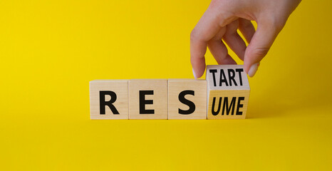 Restart and Resume symbol. Hand turns cubes and changes the word Resume to Restart. Beautiful...