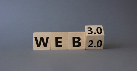 Web 3.0 vs Web 2.0 symbol. Turned wooden cubes with words web 2.0 to web 3.0. Beautiful grey background. Business concept. Copy space