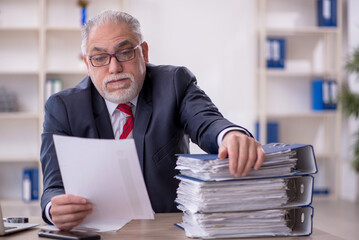 Old male employee and too much work in the office