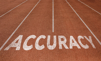 Accuracy written on running track, New Concept on running track text in white colour
