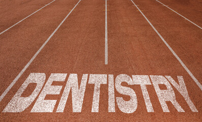 Fototapeta na wymiar Dentistry written on running track, New Concept on running track text in white colour