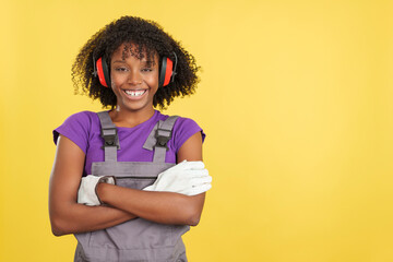 Cool afro female carpenter in work uniform