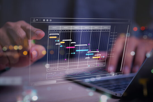 Man planning project management schedule on computer virtual screen