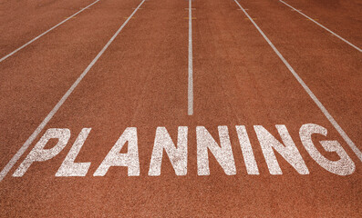 PLANNING written on running track, New Concept on running track text in white colour