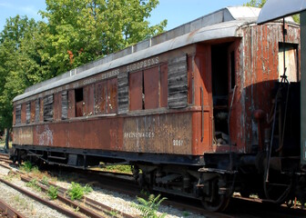 Old rusty wagons on the railroad tracks of the train station