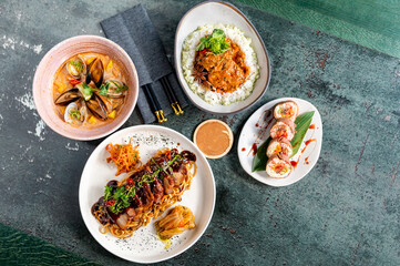 Table with set asian food, top view.
