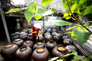 Traditional "soy sauce" food production facility in Nghe An province, Vietnam. Soy sauce is fermented from soybeans